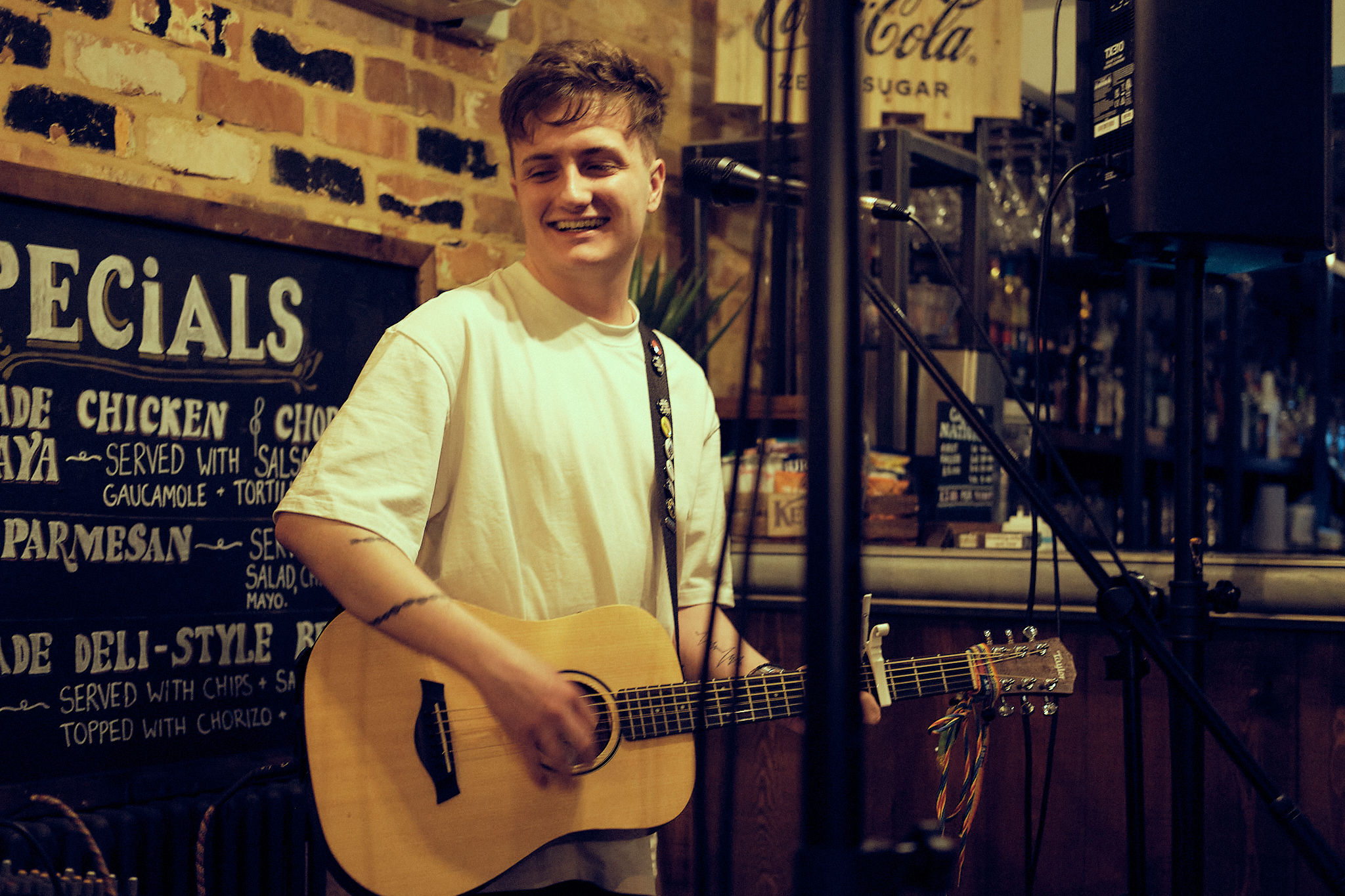 Michael Plumb performing live with an acoustic guitar